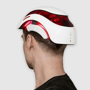 Person wearing LED hair growth helmet for scalp care